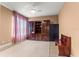 Spacious bedroom with neutral tones, large built-in shelving, ceiling fan, and a cozy rug at 6551 Se 11Th Loop, Ocala, FL 34472
