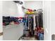 A full walk-in closet with wire shelving that is full of clothing and accessories for storage at 6551 Se 11Th Loop, Ocala, FL 34472