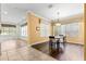 Dining room with stylish wood floors and view to kitchen at 6551 Se 11Th Loop, Ocala, FL 34472