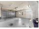Large garage with durable flooring, equipped with an automated door and side entry at 6551 Se 11Th Loop, Ocala, FL 34472