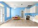 Bright and airy living room with neutral tile flooring and white ceiling fan at 6551 Se 11Th Loop, Ocala, FL 34472