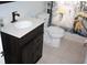 Bathroom featuring dark wood vanity, white countertop, and shower with a Parisian theme at 8650 Sw 108Th Pl, Ocala, FL 34481