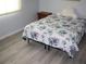 Bedroom featuring floral bedding and bright window at 8650 Sw 108Th Pl, Ocala, FL 34481