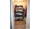 Walk-in closet with ample shelving and storage for clothes, towels and storage containers at 8650 Sw 108Th Pl, Ocala, FL 34481
