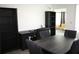 A dining area offering dark wood table with seating and storage cabinets at 8650 Sw 108Th Pl, Ocala, FL 34481