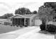 Charming single-story home featuring a screened-in porch, well-manicured lawn, and attached garage at 8650 Sw 108Th Pl, Ocala, FL 34481