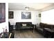 Cozy living room with hardwood floors, a ceiling fan, and comfortable sofas at 8650 Sw 108Th Pl, Ocala, FL 34481