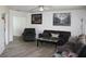 Inviting living room with hardwood floors, neutral walls, stylish furniture, and ample natural light at 8650 Sw 108Th Pl, Ocala, FL 34481