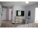 Spacious main bedroom features hardwood floors, walk-in closet, dresser, and ceiling fan at 8650 Sw 108Th Pl, Ocala, FL 34481