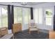 Relaxing sunroom features furniture, natural lighting, a ceiling fan, and a sliding door at 8650 Sw 108Th Pl, Ocala, FL 34481
