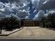 Charming home with manicured landscaping, a spacious driveway, and a two-car garage at 9238 Sw 60Th Court Rd, Ocala, FL 34476