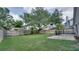 Large backyard with lush grass, privacy fence, and space for activities and relaxation at 949 Woodsong Way, Clermont, FL 34714