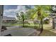 Fenced backyard with a brick patio and mature trees creating a private outdoor space at 949 Woodsong Way, Clermont, FL 34714