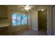 Cozy dining area features tiled floor, natural light from window, and access to pantry at 949 Woodsong Way, Clermont, FL 34714