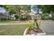 Charming single-story home features a well-manicured lawn, mature trees, and a cozy mailbox area at 949 Woodsong Way, Clermont, FL 34714