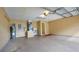 Spacious garage with high ceilings, neutral walls, and room for storage or workshop at 949 Woodsong Way, Clermont, FL 34714