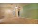 Open living room shows high ceilings, ceiling fan, and carpeted floor, adjacent to entrance at 949 Woodsong Way, Clermont, FL 34714