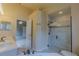 Spacious bathroom featuring a soaking tub, double vanity, and glass walk-in shower at 949 Woodsong Way, Clermont, FL 34714