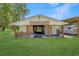 Exterior view of barn featuring an open design, green lawn, and space for storage at 975 Cr 542E, Bushnell, FL 33513