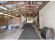 Interior view of a barn with stalls and an aisleway, showing the layout and structure at 975 Cr 542E, Bushnell, FL 33513