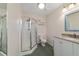 Cozy bathroom featuring a stand-up shower, vanity and mirror at 975 Cr 542E, Bushnell, FL 33513