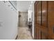 Ensuite bathroom featuring walk-in shower, vanity with workspace, and tile flooring at 975 Cr 542E, Bushnell, FL 33513