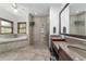 Bathroom featuring soaking tub, walk-in shower, and double vanity with tile flooring at 975 Cr 542E, Bushnell, FL 33513
