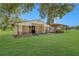 Exterior view of barn featuring an open design, green lawn, and space for storage at 975 Cr 542E, Bushnell, FL 33513
