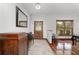 Entryway with hardwood floors, a hall tree and view of the front yard at 975 Cr 542E, Bushnell, FL 33513