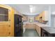 Traditional-style kitchen with ample cabinet space and an adjacent eating area at 975 Cr 542E, Bushnell, FL 33513
