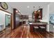 Spacious kitchen with an island, stainless steel appliances, dark wooden cabinets, and granite countertops at 975 Cr 542E, Bushnell, FL 33513