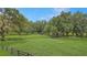 Beautiful acreage with mature trees and perimeter fencing at 975 Cr 542E, Bushnell, FL 33513