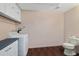 Laundry room with washer, dryer, toilet, and vanity providing an efficient means of getting needed housework done at 975 Cr 542E, Bushnell, FL 33513