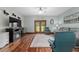 Comfortable living room with a ceiling fan, a TV set above a fireplace, and a view to the outside at 975 Cr 542E, Bushnell, FL 33513