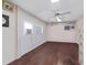 Office with wood floors, ceiling fan, and multiple windows, providing an ideal area to work while keeping tabs on the horses at 975 Cr 542E, Bushnell, FL 33513