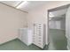 This utility room offers lots of room with the washer, dryer, storage, and access to other rooms at 975 Cr 542E, Bushnell, FL 33513