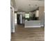 Open kitchen featuring stainless steel appliances, granite countertops, and modern lighting at 10375 Se 126Th Ln, Belleview, FL 34420