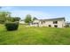 Spacious backyard featuring a fenced area and lush green grass, perfect for outdoor enjoyment at 10720 Sw 63Rd Ave, Ocala, FL 34476