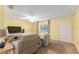 Bright living room with neutral tones and ample seating, perfect for relaxation and entertaining at 10720 Sw 63Rd Ave, Ocala, FL 34476