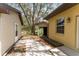 The backyard features a pathway made of paving stones that leads to the shed at 10835 Se Highway 464C, Ocklawaha, FL 32179