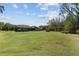 Expansive backyard featuring a pool, screened enclosure, and ample space for recreation and outdoor entertaining at 10835 Se Highway 464C, Ocklawaha, FL 32179