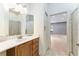 Bathroom features a shower/tub combo and an open doorway to the bonus room at 10835 Se Highway 464C, Ocklawaha, FL 32179