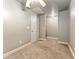 This is an empty bedroom with neutral walls, carpet and white trim; a ceiling fan is installed for comfort at 10835 Se Highway 464C, Ocklawaha, FL 32179