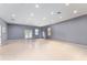 Spacious bonus room with neutral walls, recessed lighting, and double doors to the backyard at 10835 Se Highway 464C, Ocklawaha, FL 32179