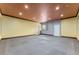 A bonus room with rubber tile floors, recessed lighting, two doors and a small window at 10835 Se Highway 464C, Ocklawaha, FL 32179