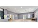 Spacious bonus room with sink, recessed lighting, and double doors to the backyard at 10835 Se Highway 464C, Ocklawaha, FL 32179