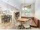 Eat-in kitchen features a breakfast nook with a built-in bench and a dining table at 10835 Se Highway 464C, Ocklawaha, FL 32179