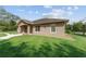 Attractive single-story home with a stone-accented facade and a well-manicured lawn at 10835 Se Highway 464C, Ocklawaha, FL 32179