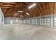 This is a large open garage with six bays and high ceilings; the building can store a lot of vehicles at 10835 Se Highway 464C, Ocklawaha, FL 32179