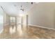 Spacious living room with high ceilings, tile flooring, and a neutral color palette at 10835 Se Highway 464C, Ocklawaha, FL 32179